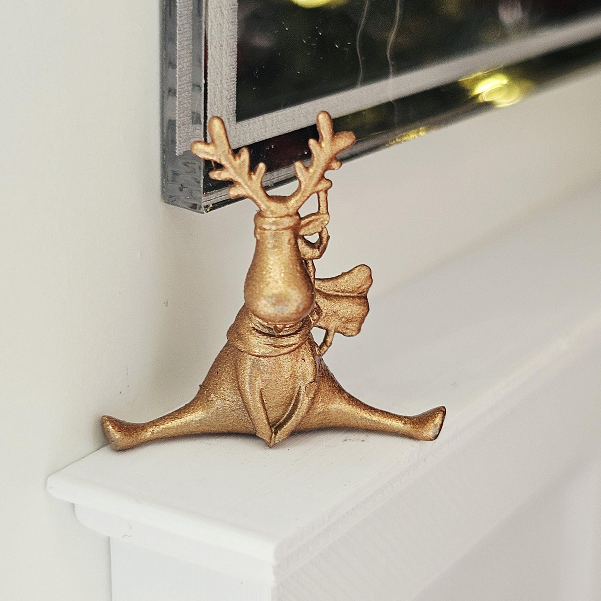 Warm metallic seated christmas reindeer ornament in a 1:12 scale dolls house display, detail view 4