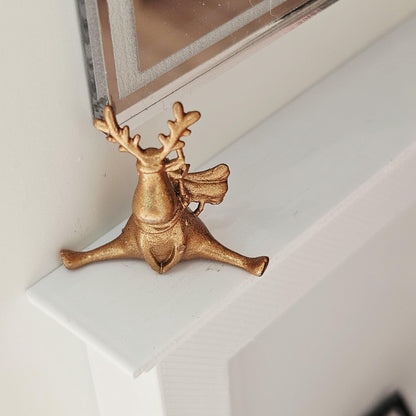 Warm metallic seated christmas reindeer ornament in a 1:12 scale dolls house display, detail view 6