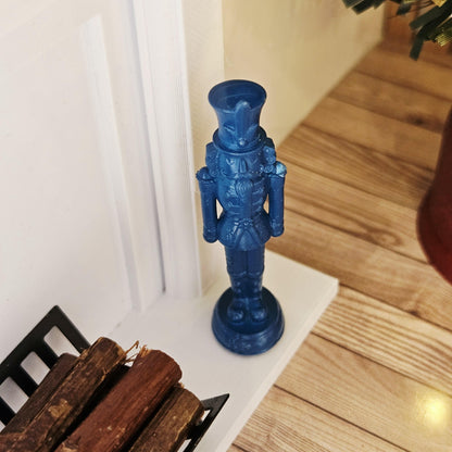 Blue christmas nutcracker ornament in a 1:12 scale dolls house display, detail view 11