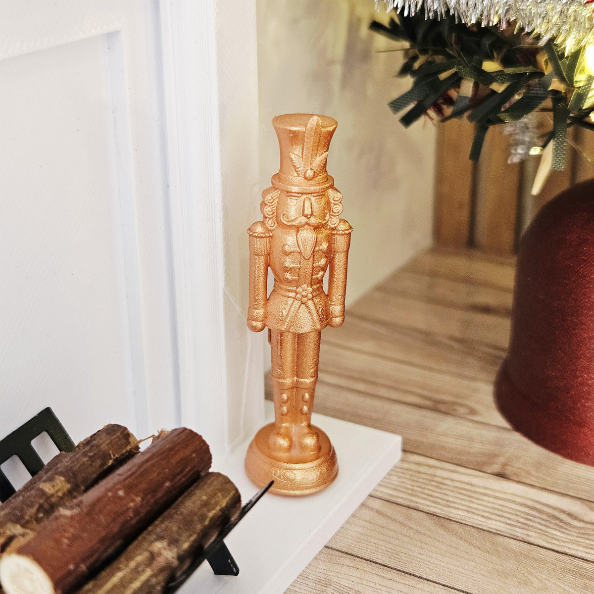 Copper christmas nutcracker ornament in a 1:12 scale dolls house display, detail view 8