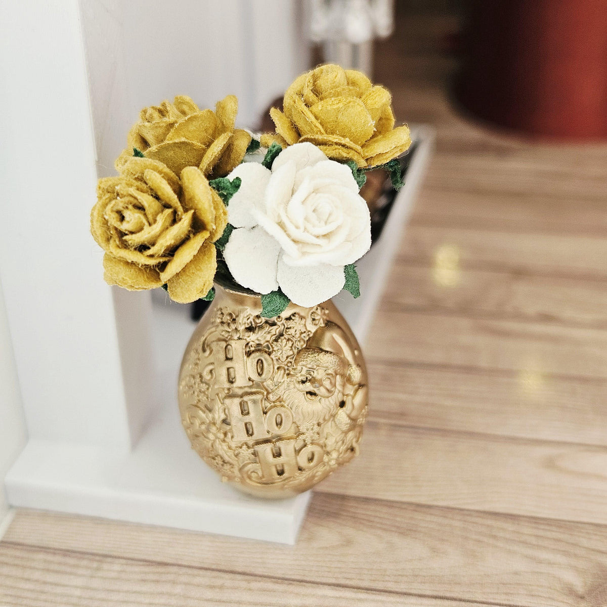 Gold santa vase with gold & white roses in a 1:12 scale dolls house display, detail view 3