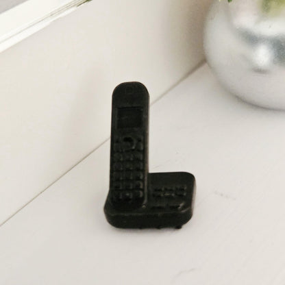 Black modern telephone with answering machine in a 1:12 scale dolls house display, detail view 8