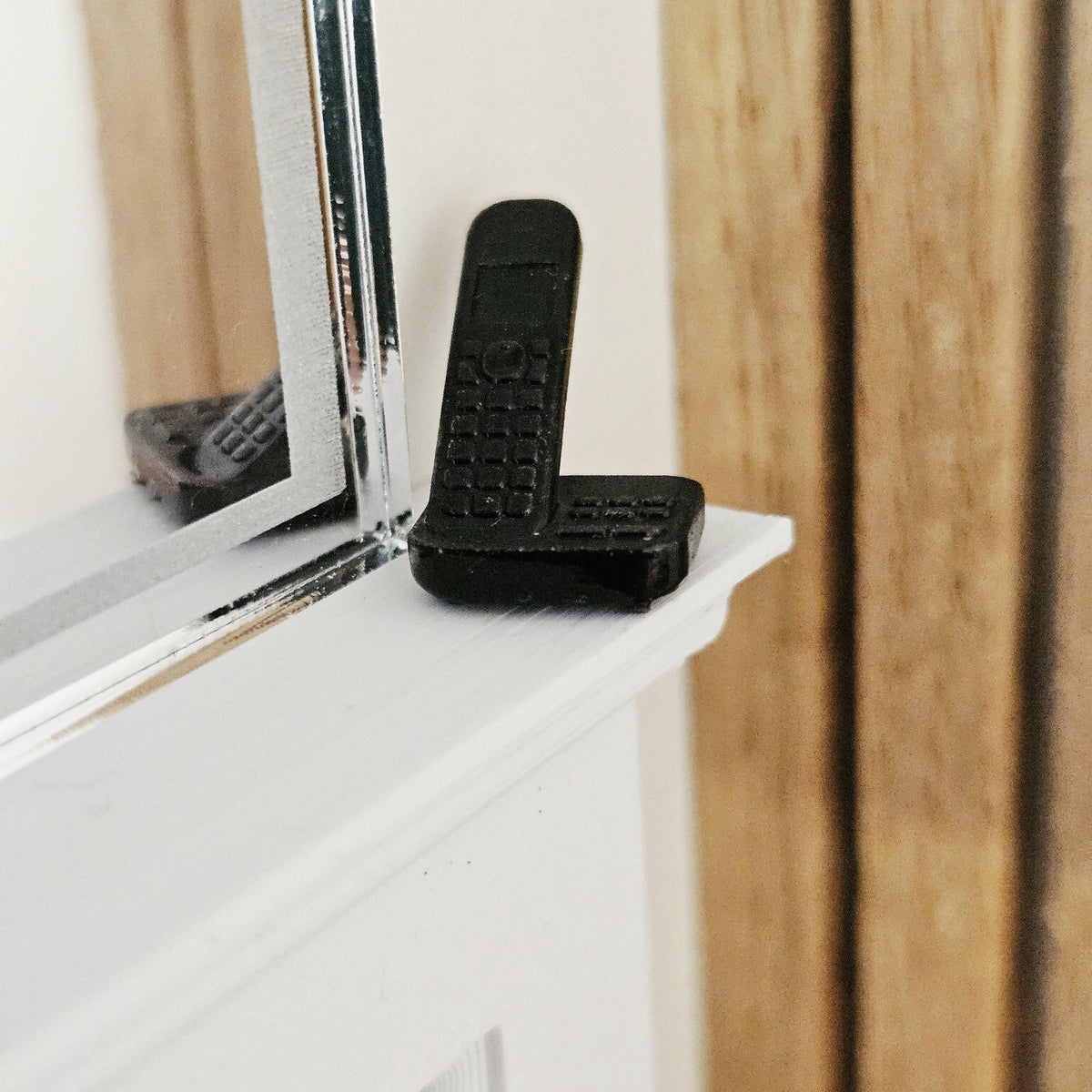 Black modern telephone with answering machine in a 1:12 scale dolls house display, detail view 9
