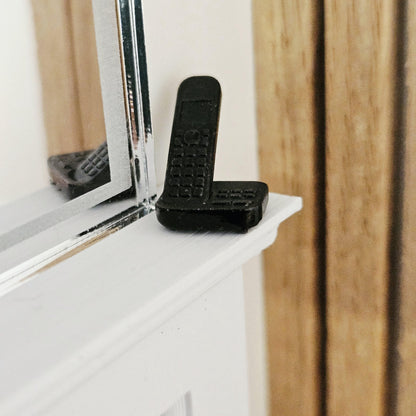 Black modern telephone with answering machine in a 1:12 scale dolls house display, detail view 9