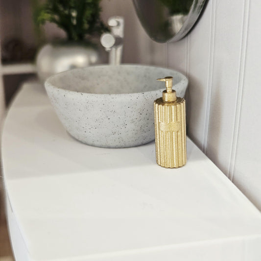 Gold ribbed soap pump in a 1:12 scale dolls house display