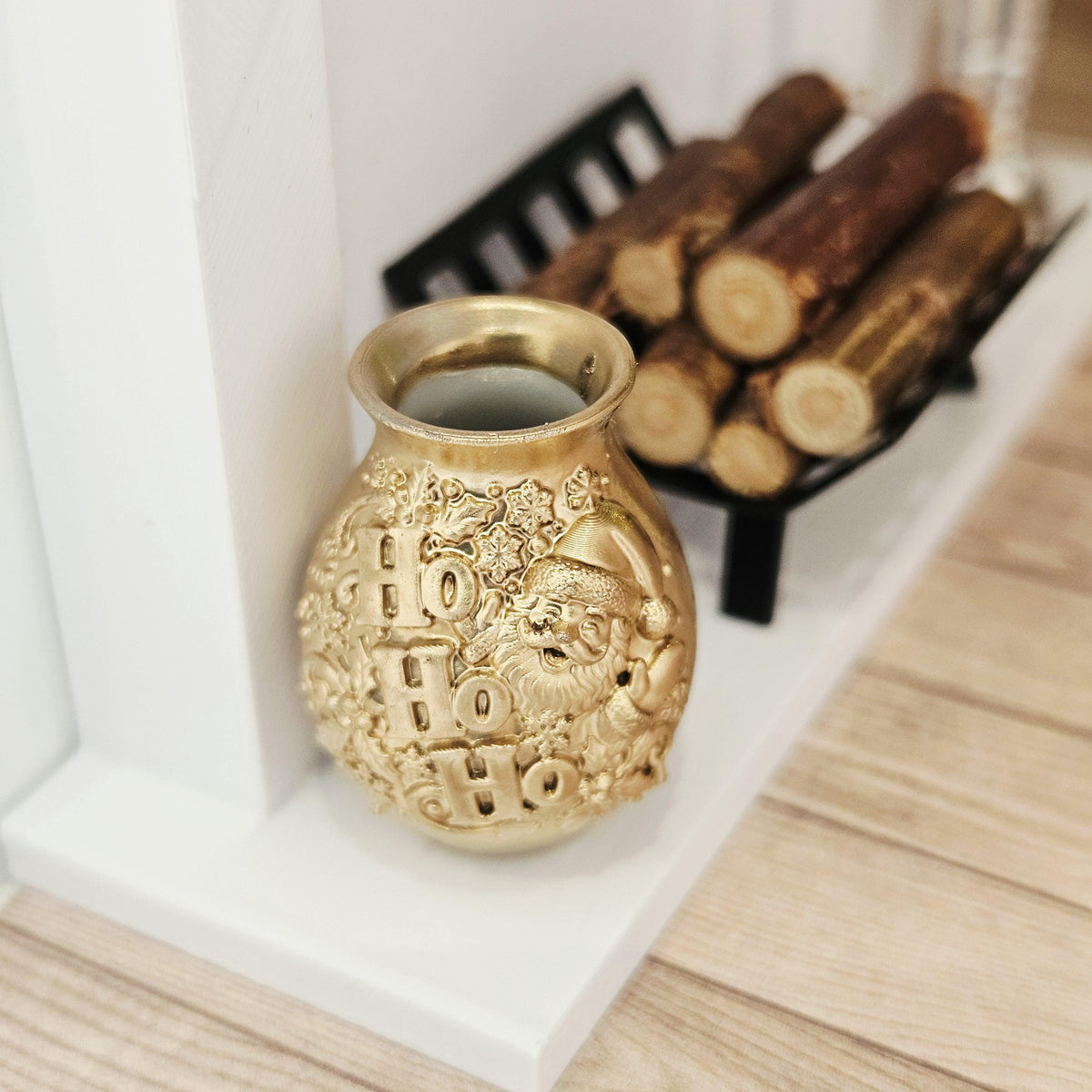 Gold santa ho ho ho vase in a 1:12 scale dolls house display